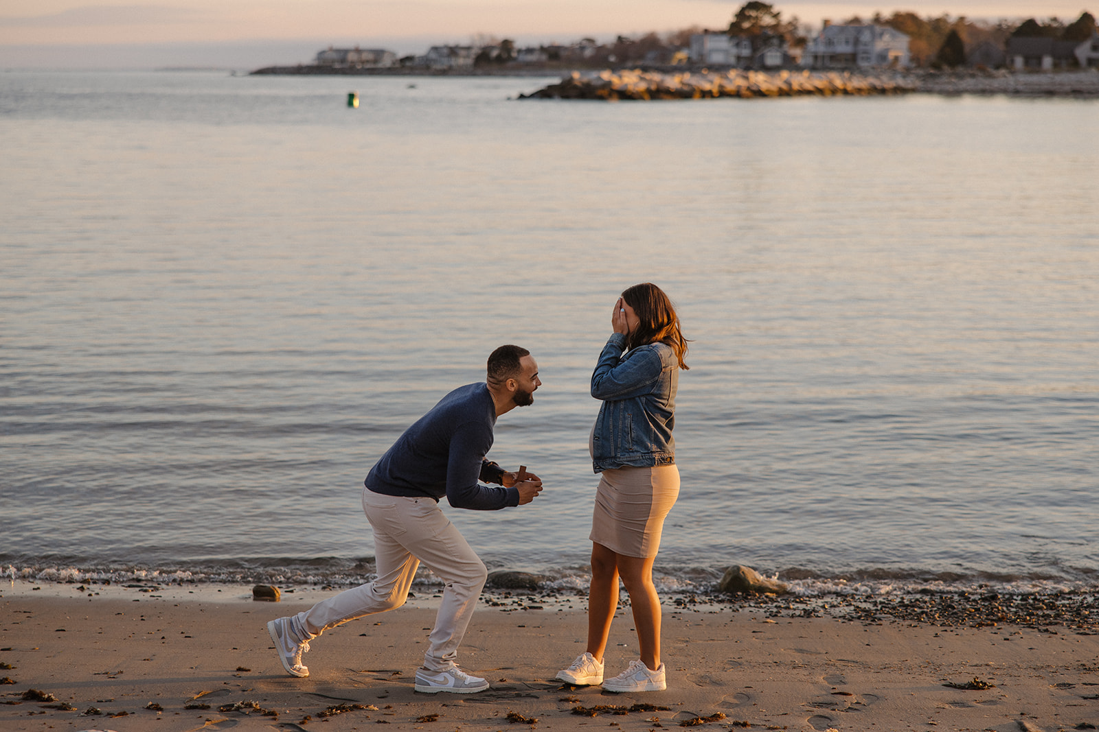 beautiful couple pose together on the beach