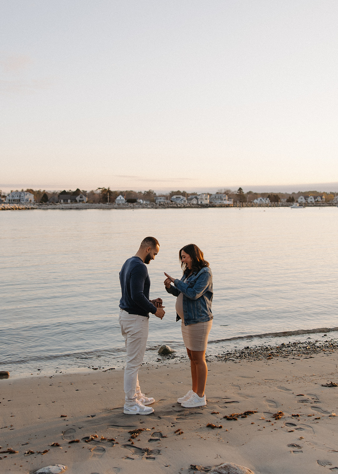 beautiful couple pose together on the beach