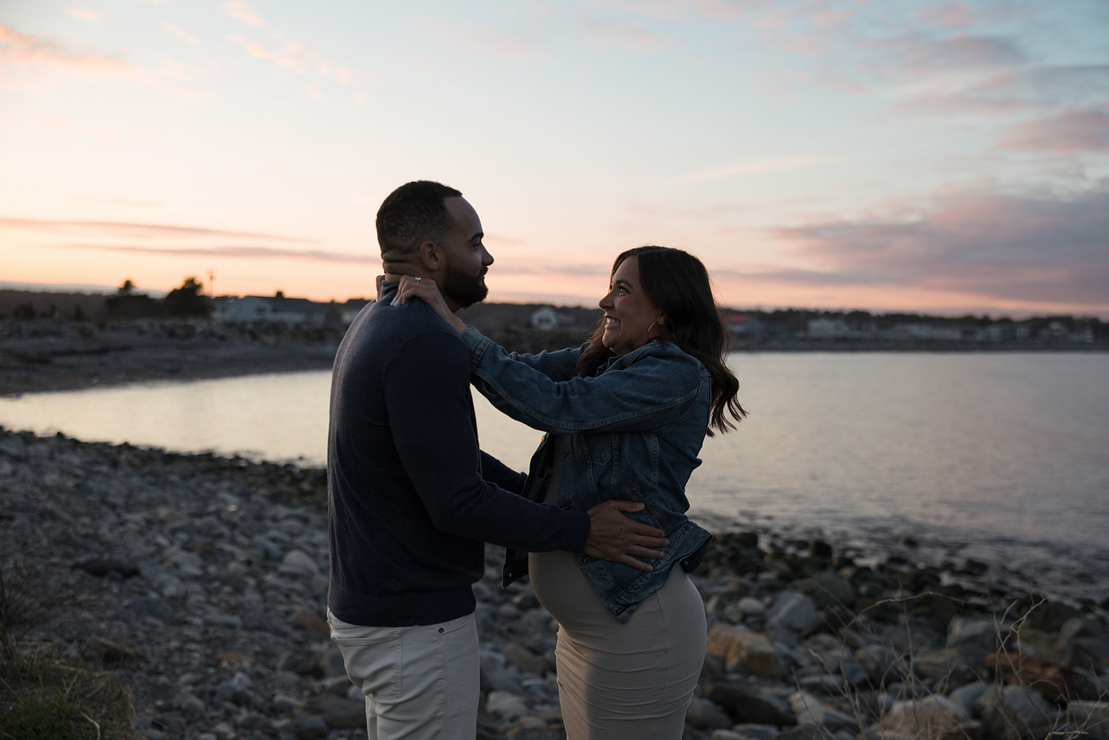 beautiful couple pose together on the beach