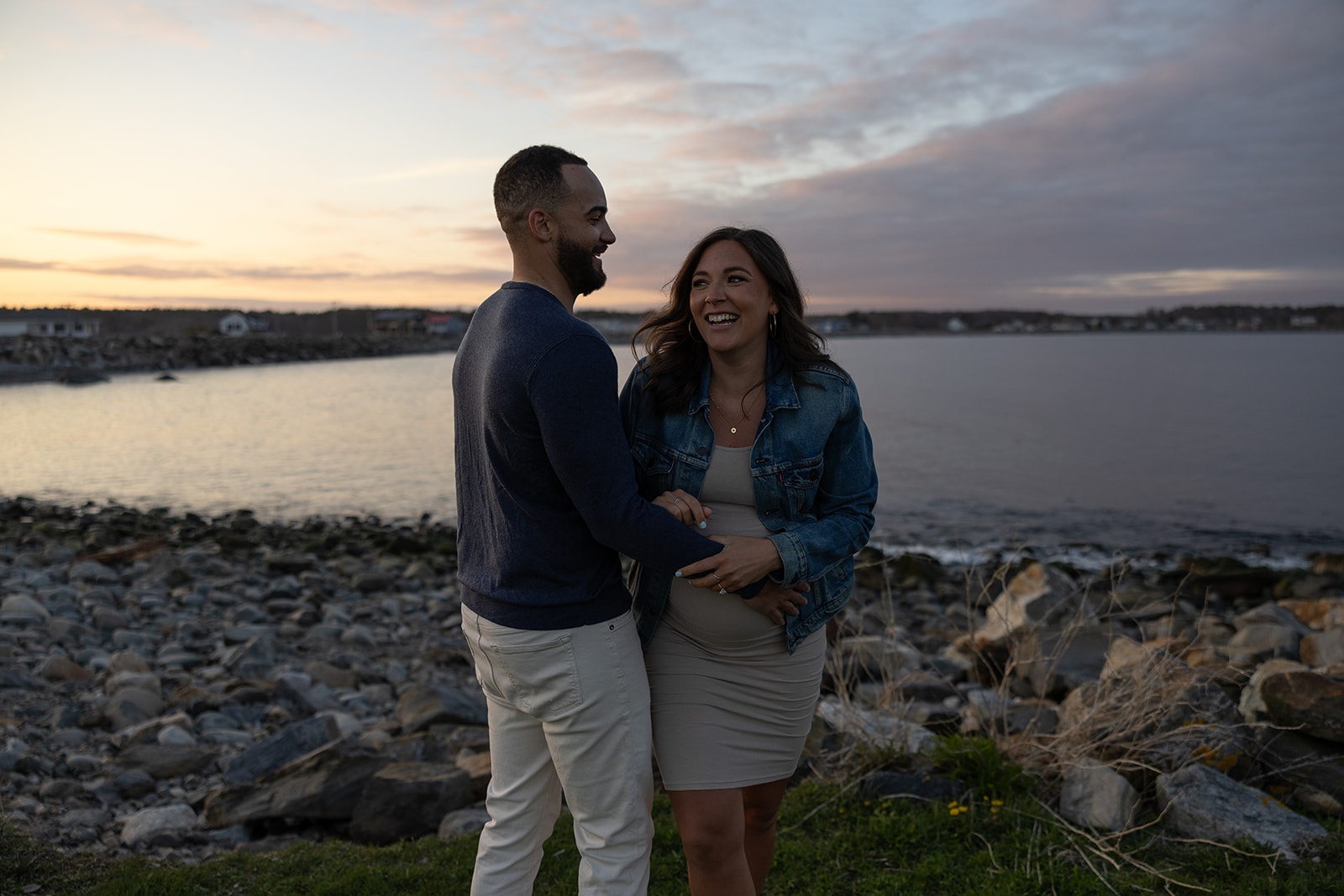 beautiful couple pose together on the beach