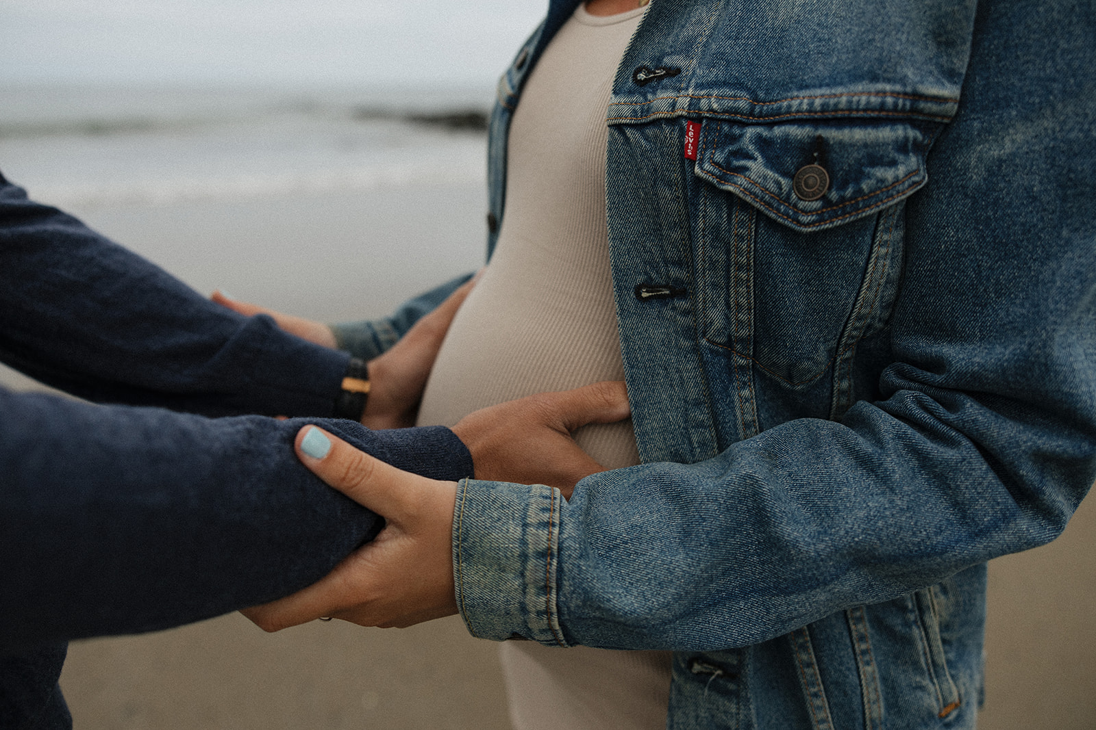 beautiful couple pose together on the beach