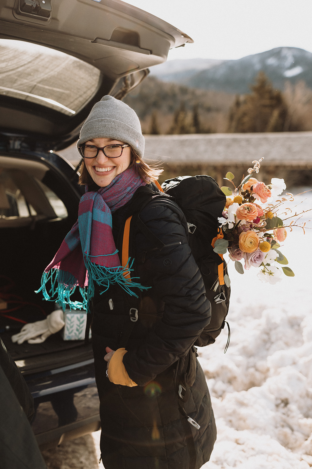 bride and groom hike together to their NH elopement site