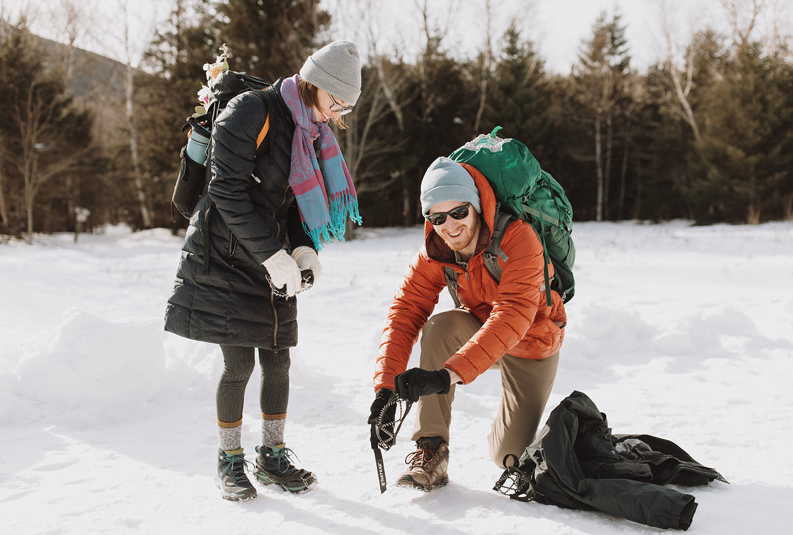 bride and groom hike together to their NH elopement site