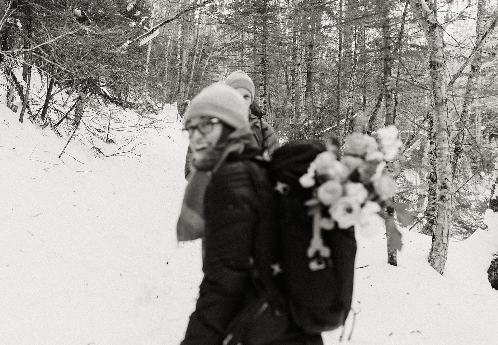 bride and groom hike together to their NH elopement site