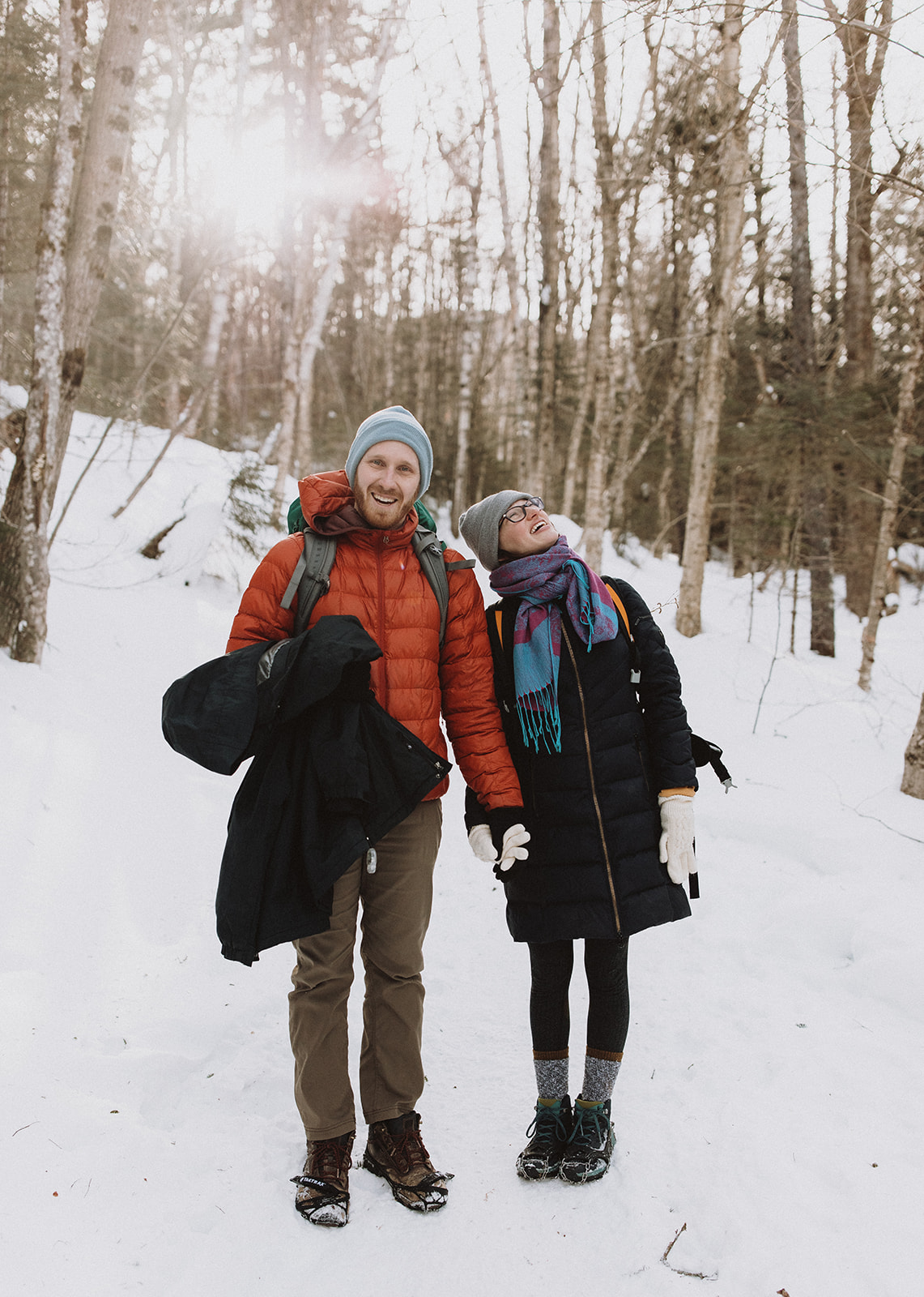 bride and groom hike together to their NH elopement site