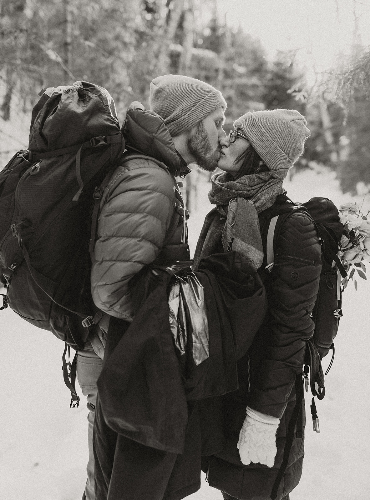 bride and groom hike together to their NH elopement site