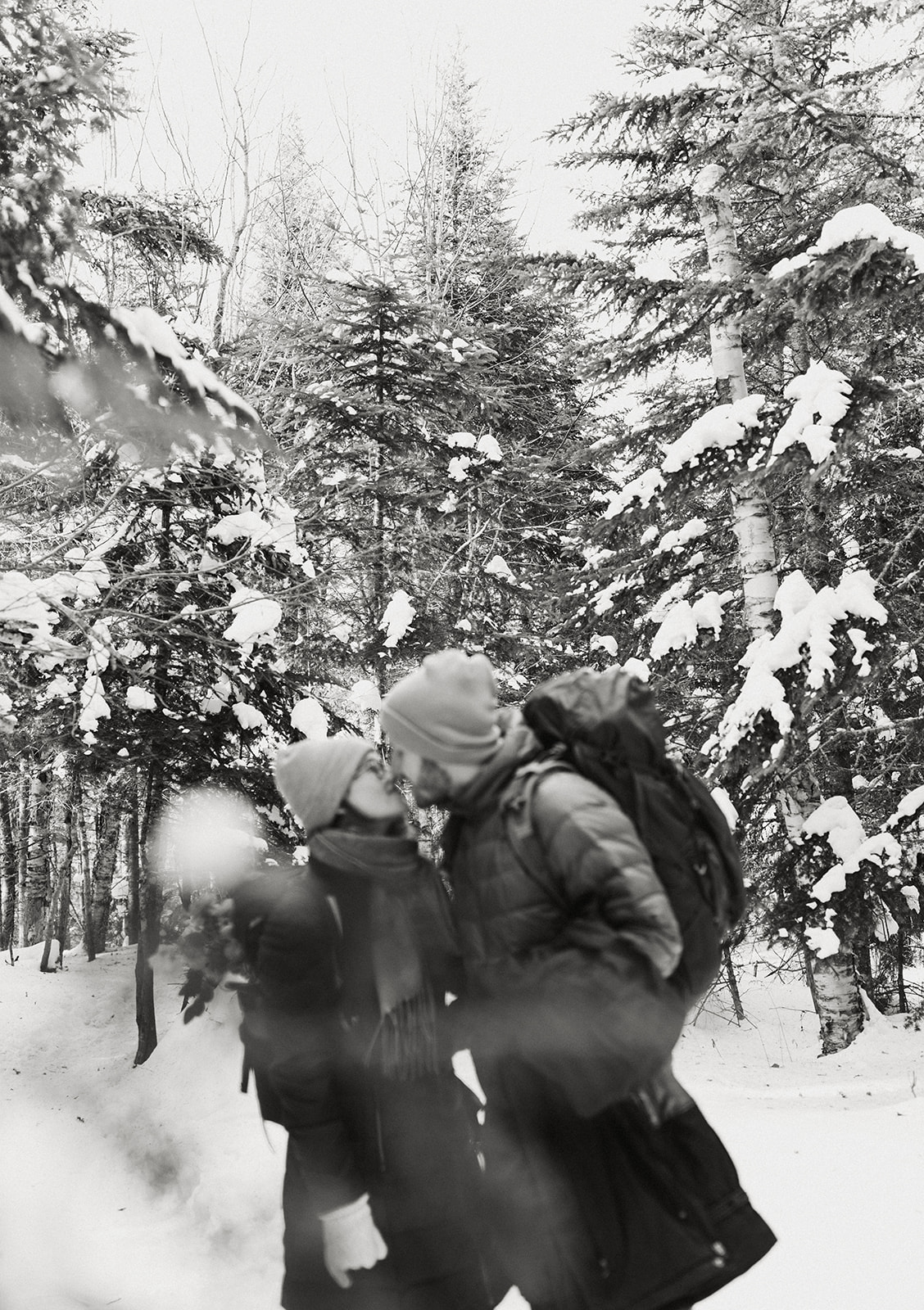 bride and groom hike together to their NH elopement site