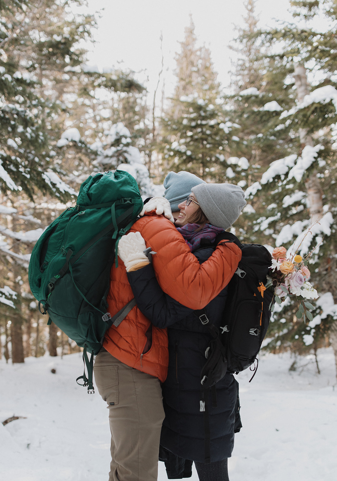 bride and groom hike together to their NH elopement site