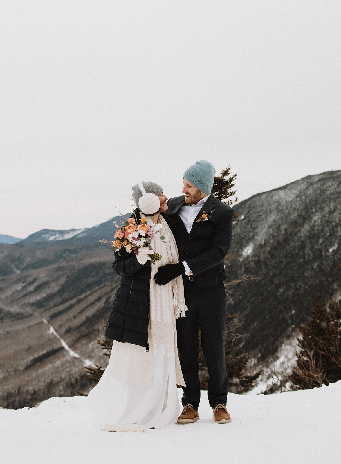 stunning couple pose together during their New Hampshire elopement at Mt. Willard