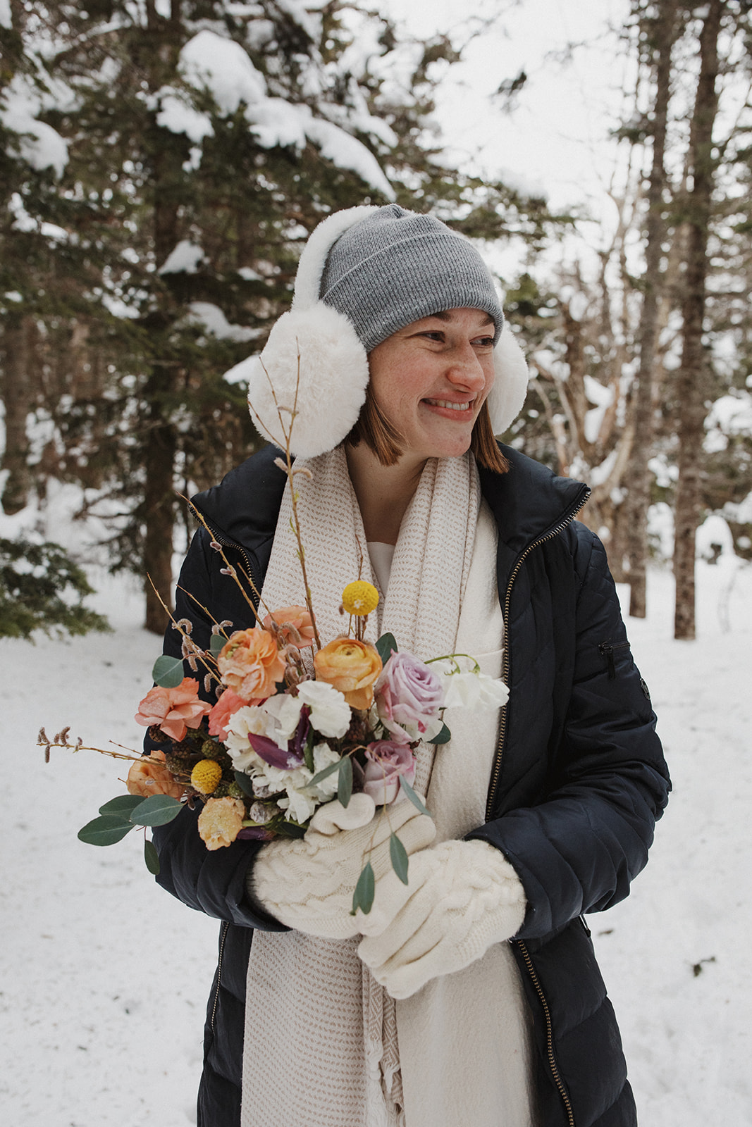 beautiful bride poses on a New Hampshire mountain after her elopement