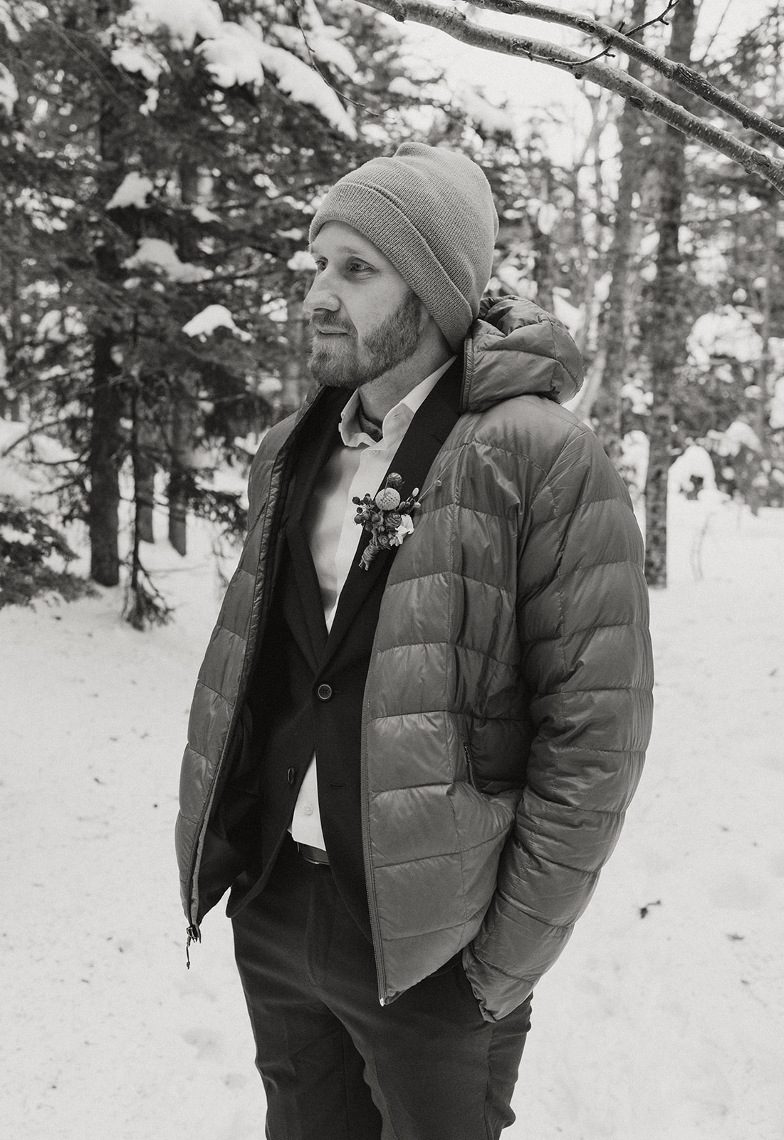 handsome groom poses for a photo