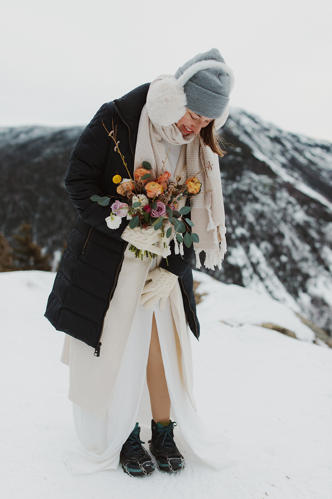 beautiful bride poses on a New Hampshire mountain after her elopement