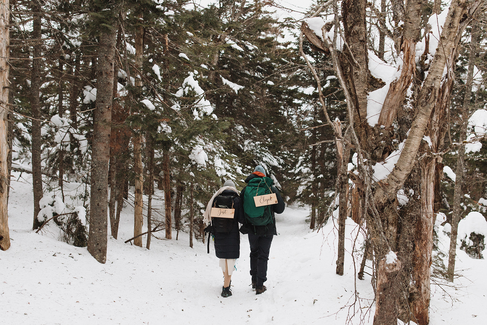 bride and groom hike down from their Mt. Willard elopement ceremony