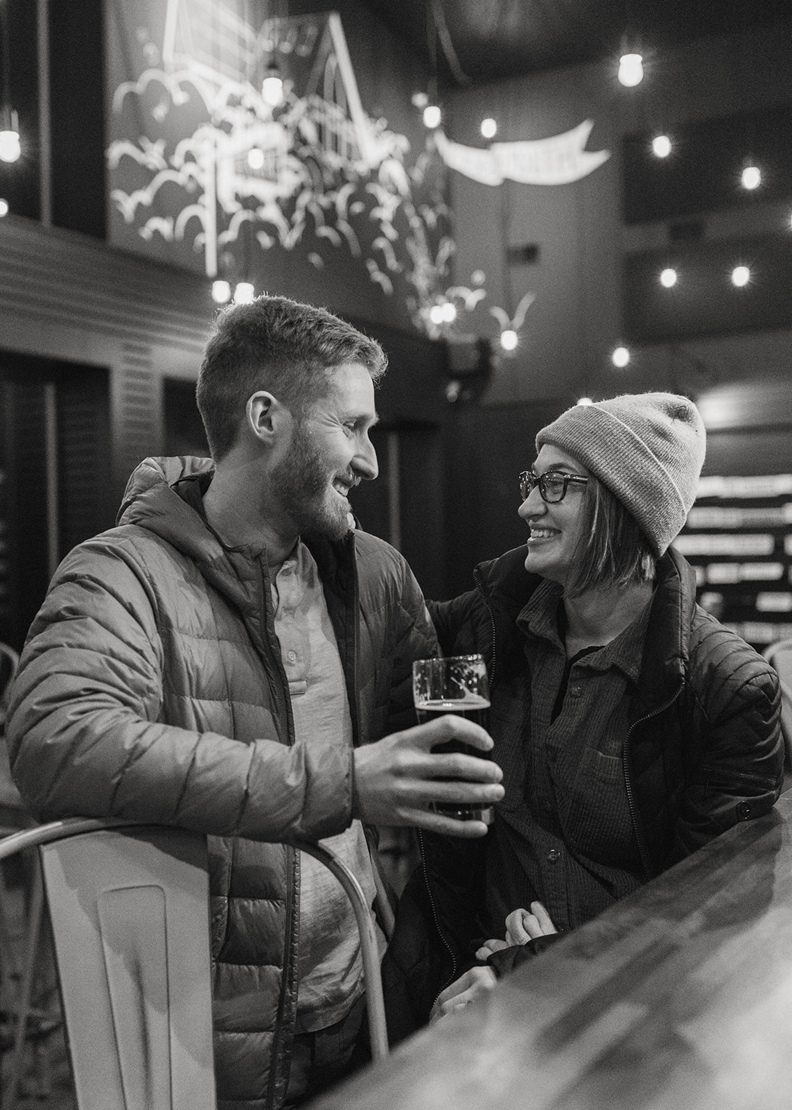 beautiful bride and groom share a beer after their dreamy New Hampshire wedding day