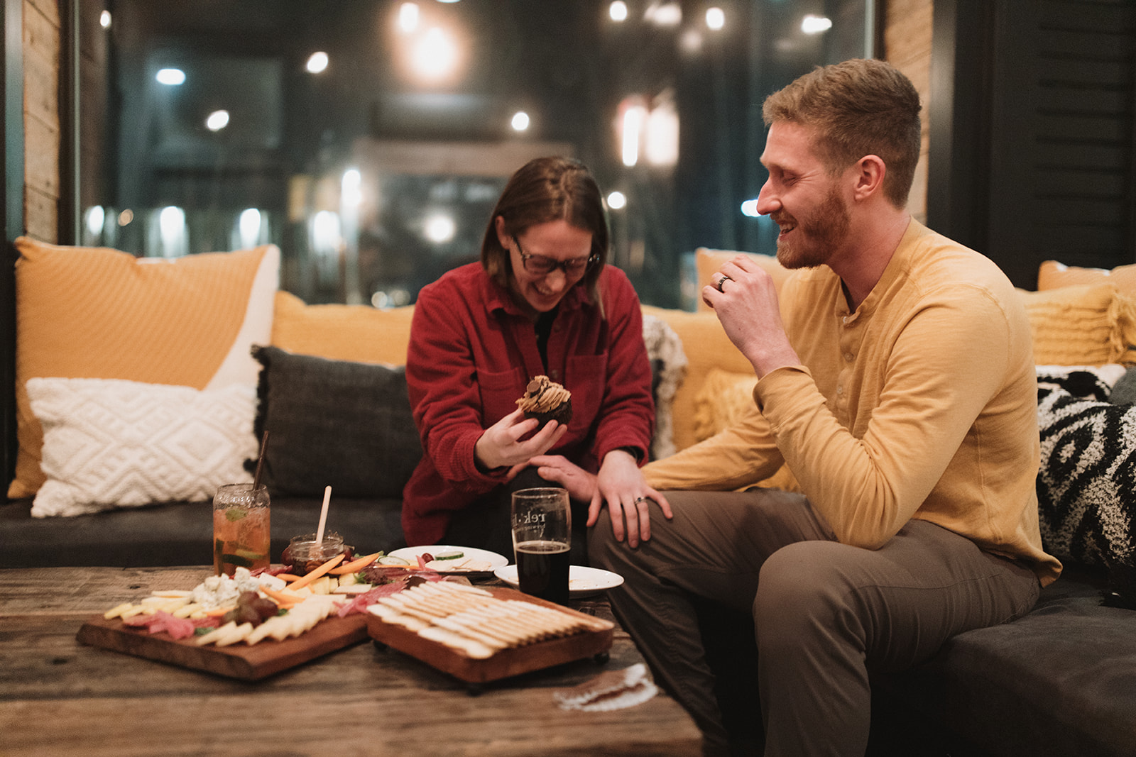 beautiful bride and groom share a beer after their dreamy winter elopement in nh