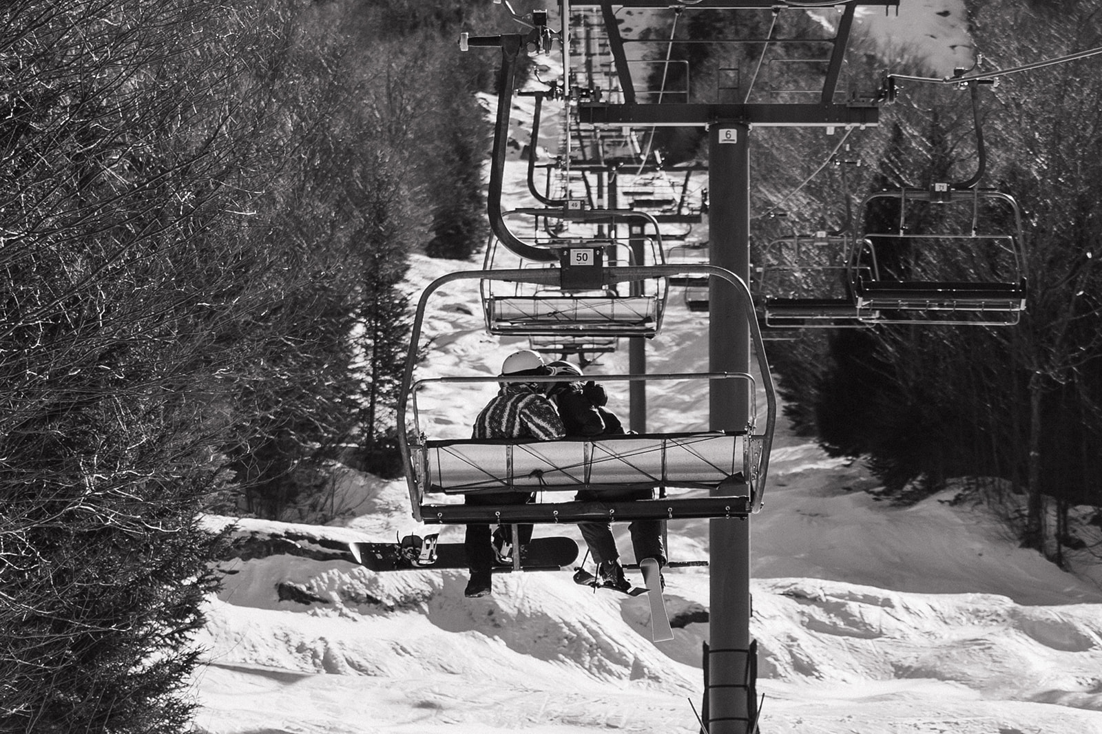 creative winter skiing engagement photos in the White Mountains