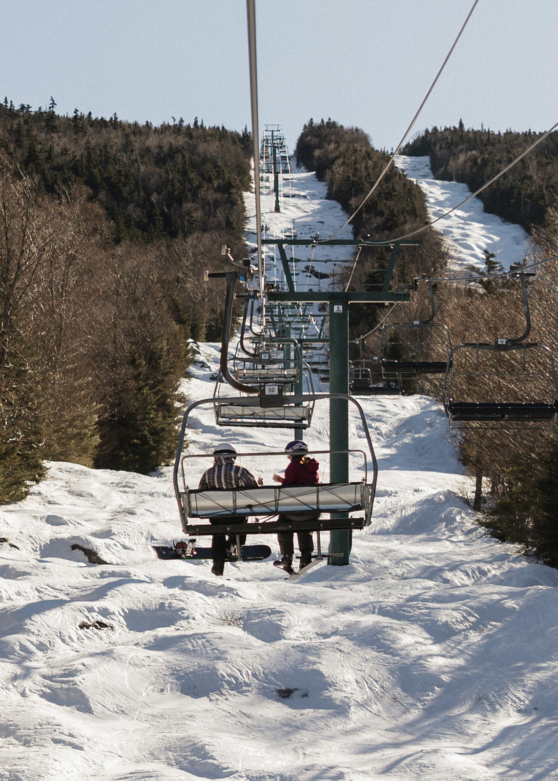 creative winter skiing engagement photos in the White Mountains