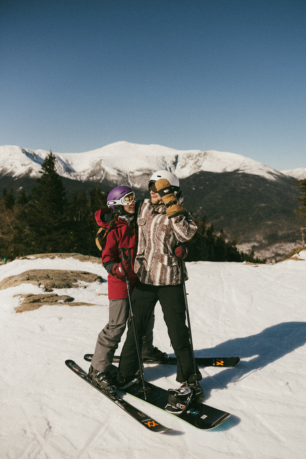 creative winter skiing engagement photos in the White Mountains