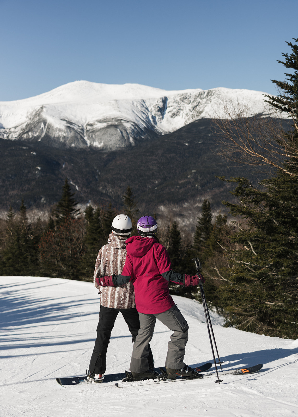 creative winter skiing engagement photos in the White Mountains