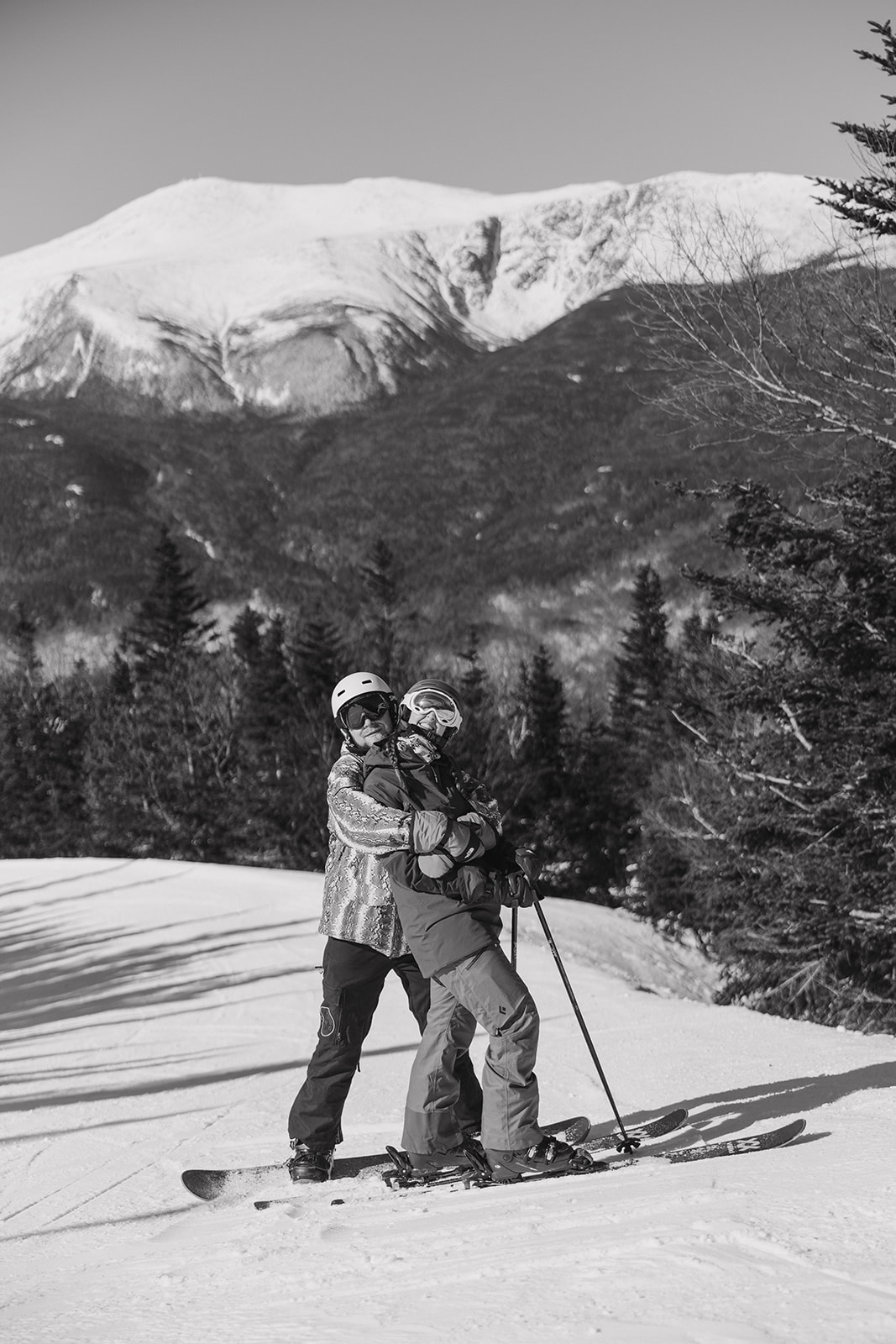 creative winter skiing engagement photos in the White Mountains