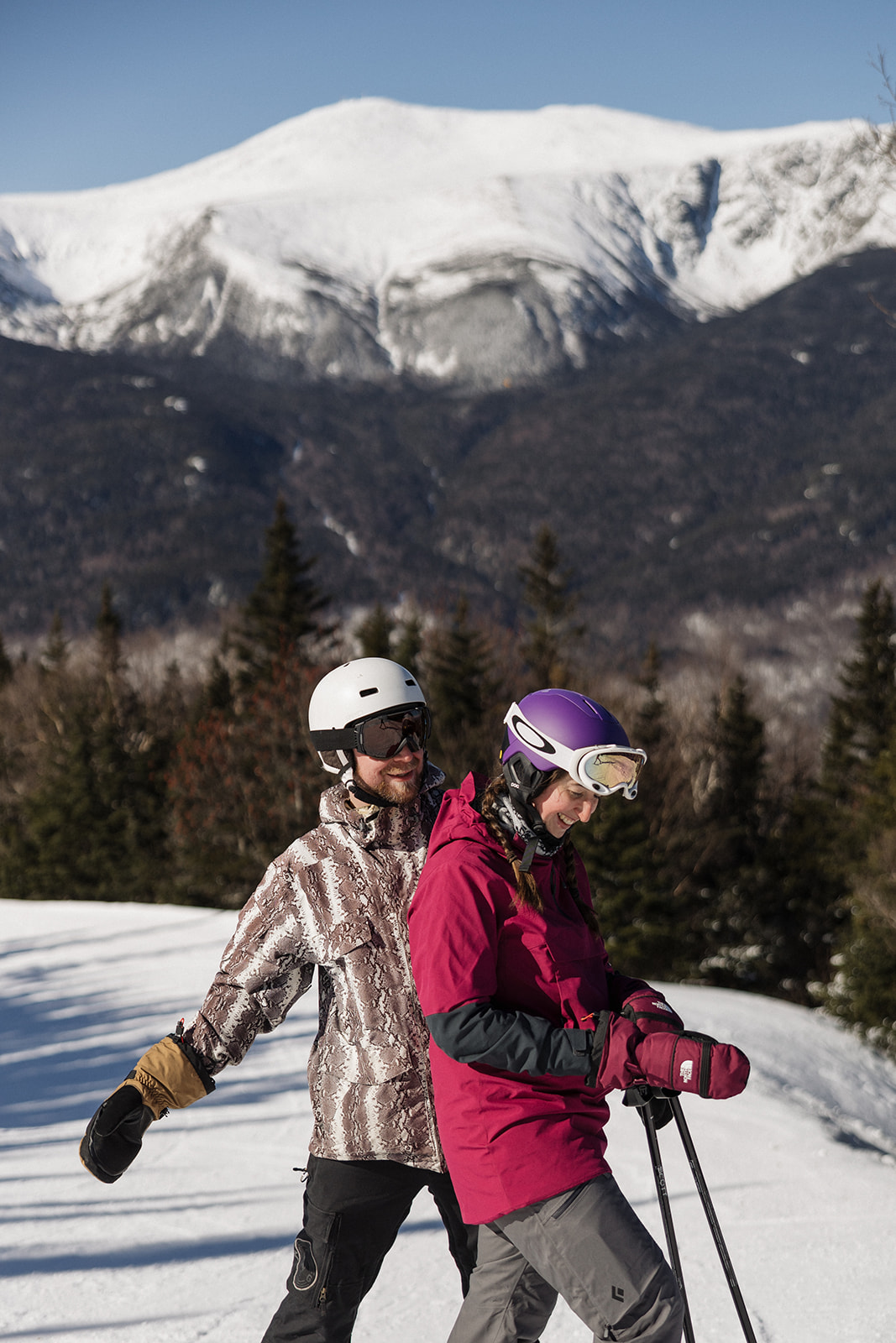 creative winter skiing engagement photos in the White Mountains