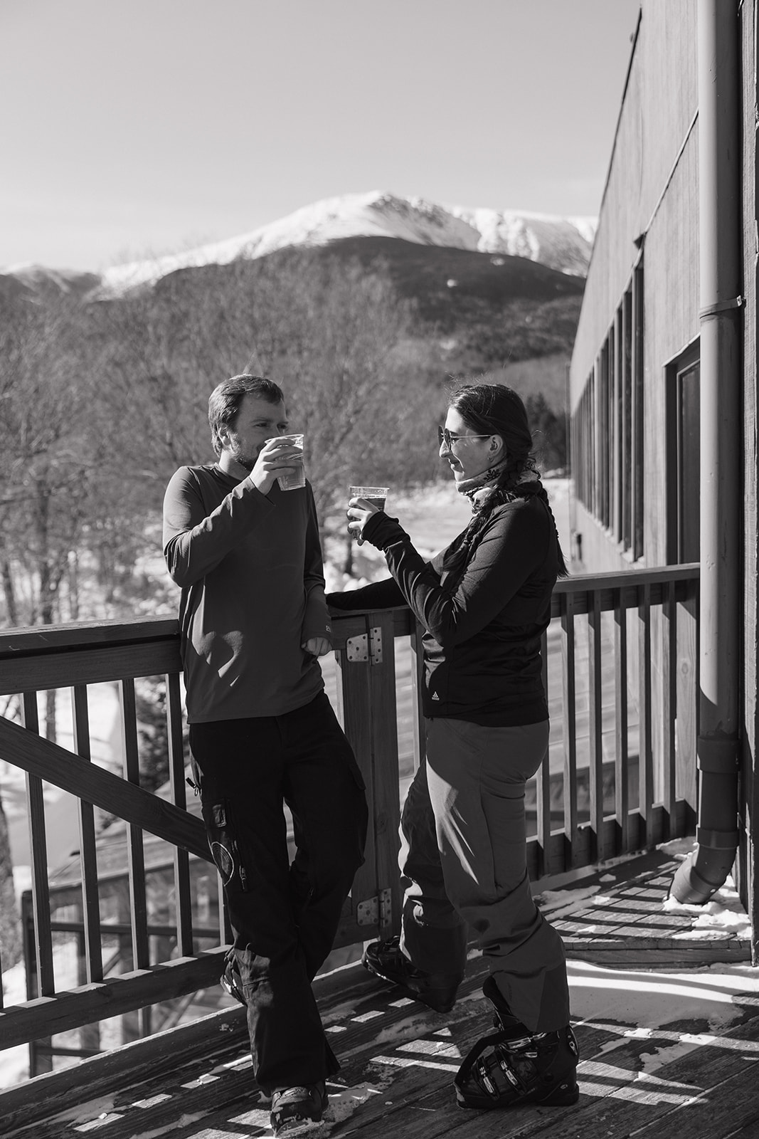 beautiful couple pose together during with the White Mountains in the background