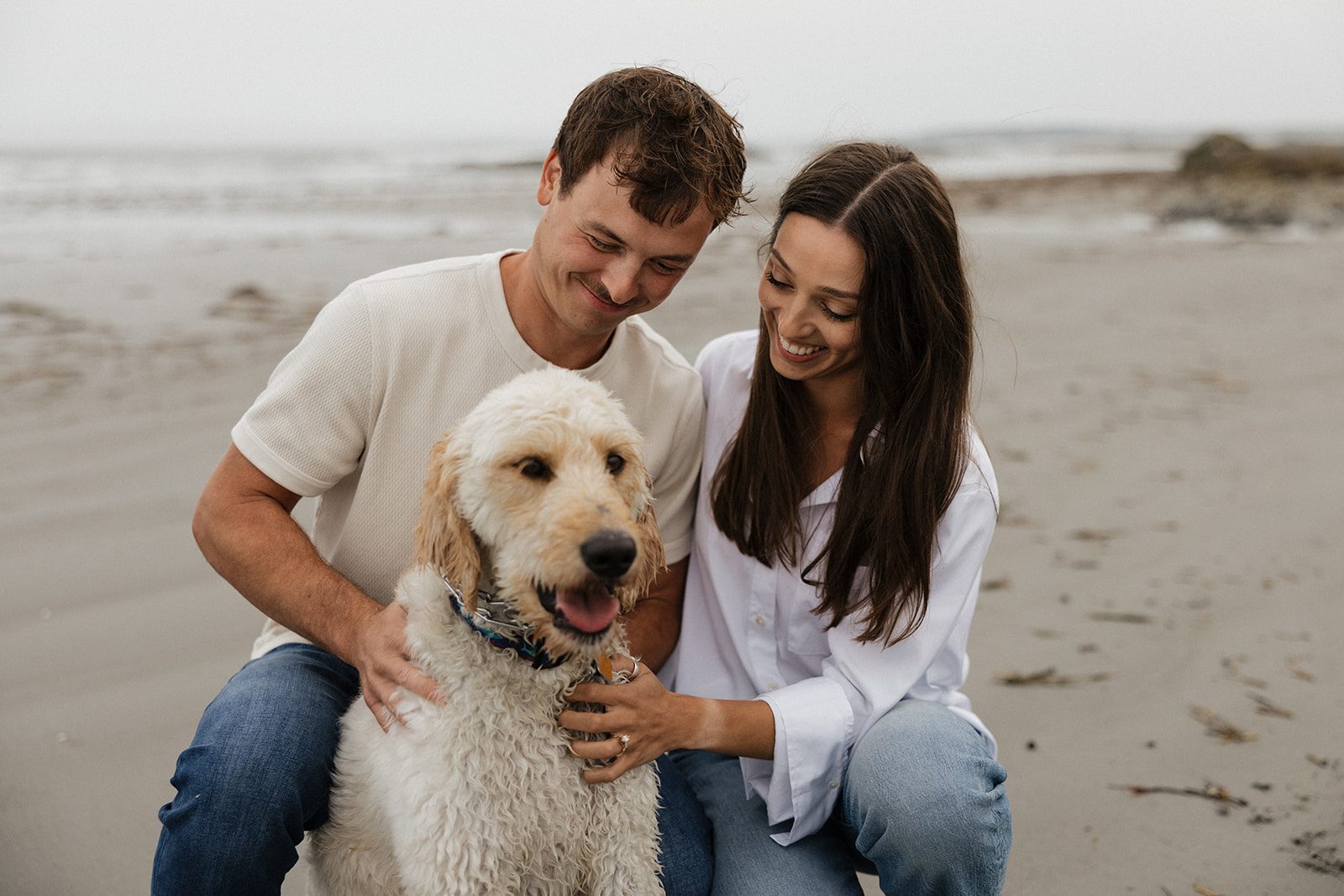 beautiful couple pose with their dog