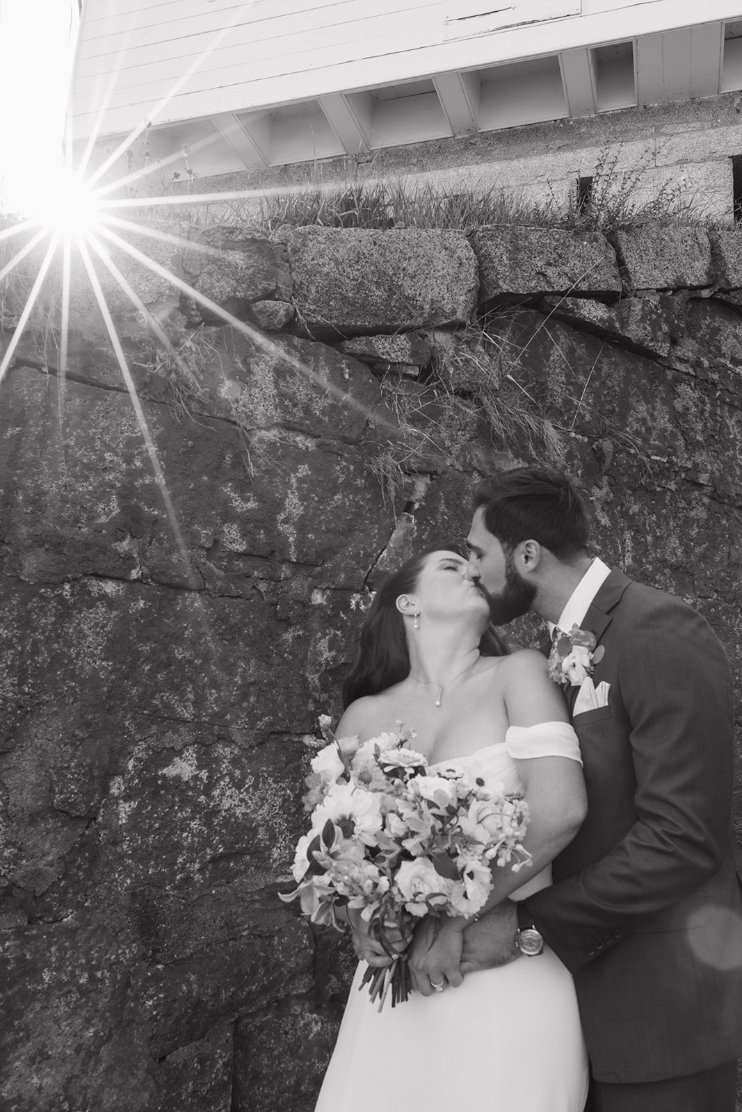 Elegant outdoor wedding photography of bride and groom kissing at their Pepperrell Cove wedding from Erica Warren
