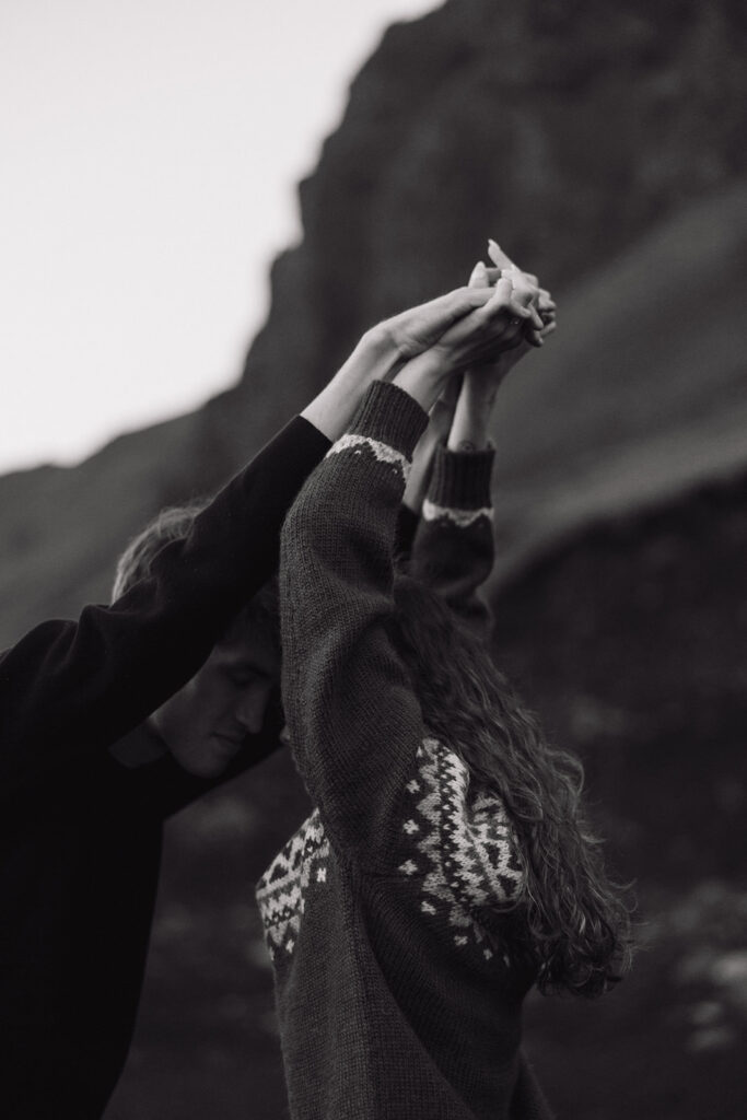 stunning couple share an intimate moment on the icelandic beach at sunset