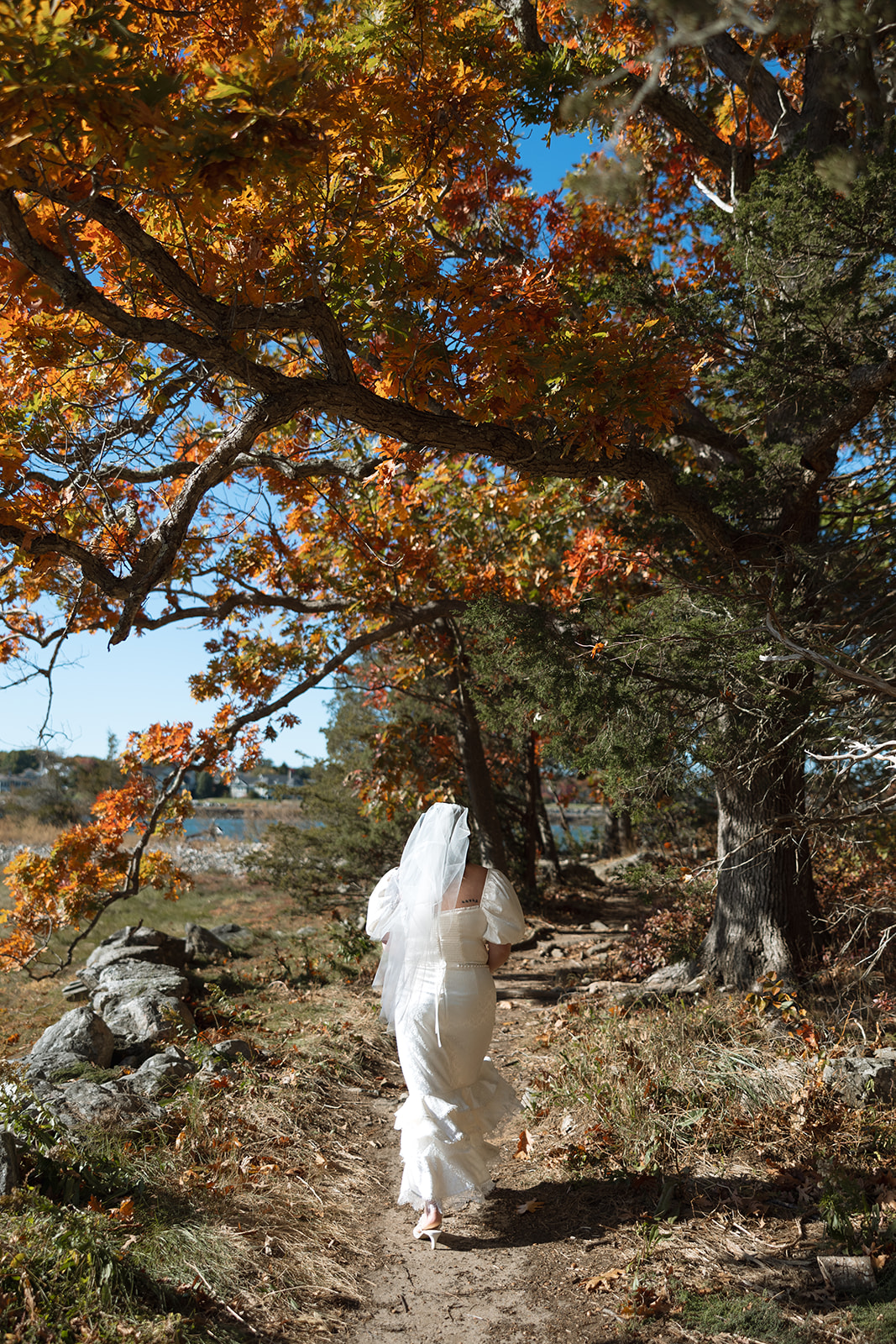 Bride walking in Odiorne State Park in Rye, NH