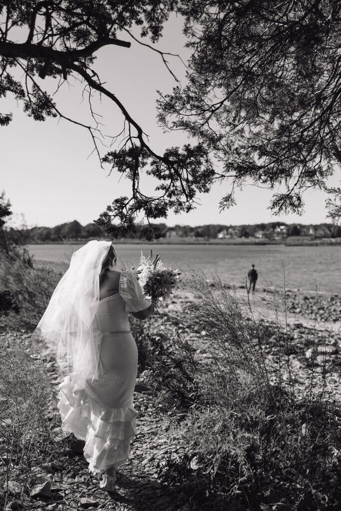 Bride walking in Odiorne State Park in Rye, NH