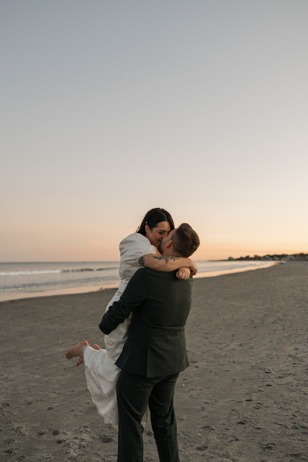 beautiful bride and groom share a kiss on their special day