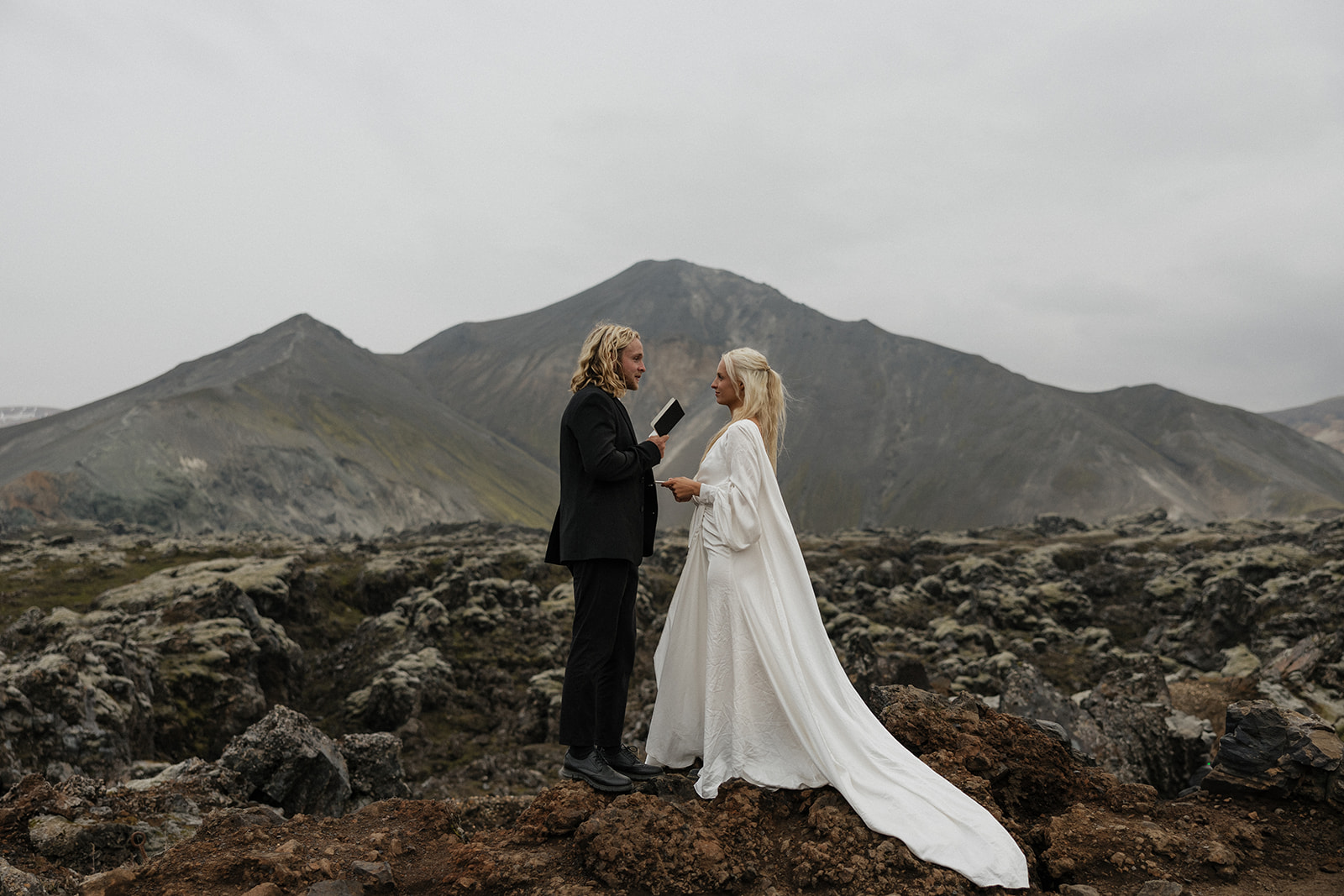 bride and groom say their vows in iceland