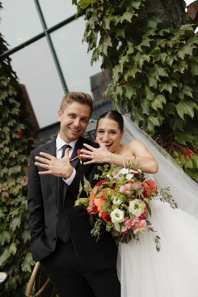 Bride and groom celebrating saying their vows at Via Vecchia in downtown Portland, Maine