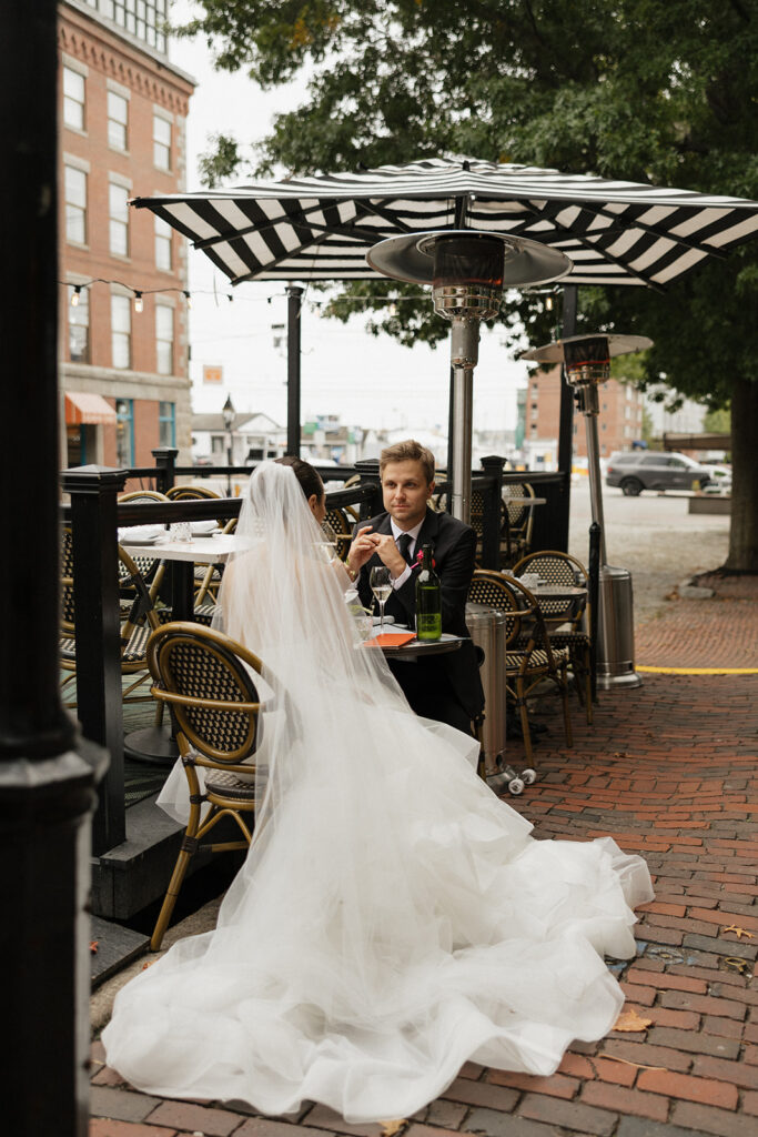 Bride and groom celebrating saying their vows at Via Vecchia in downtown Portland, Maine