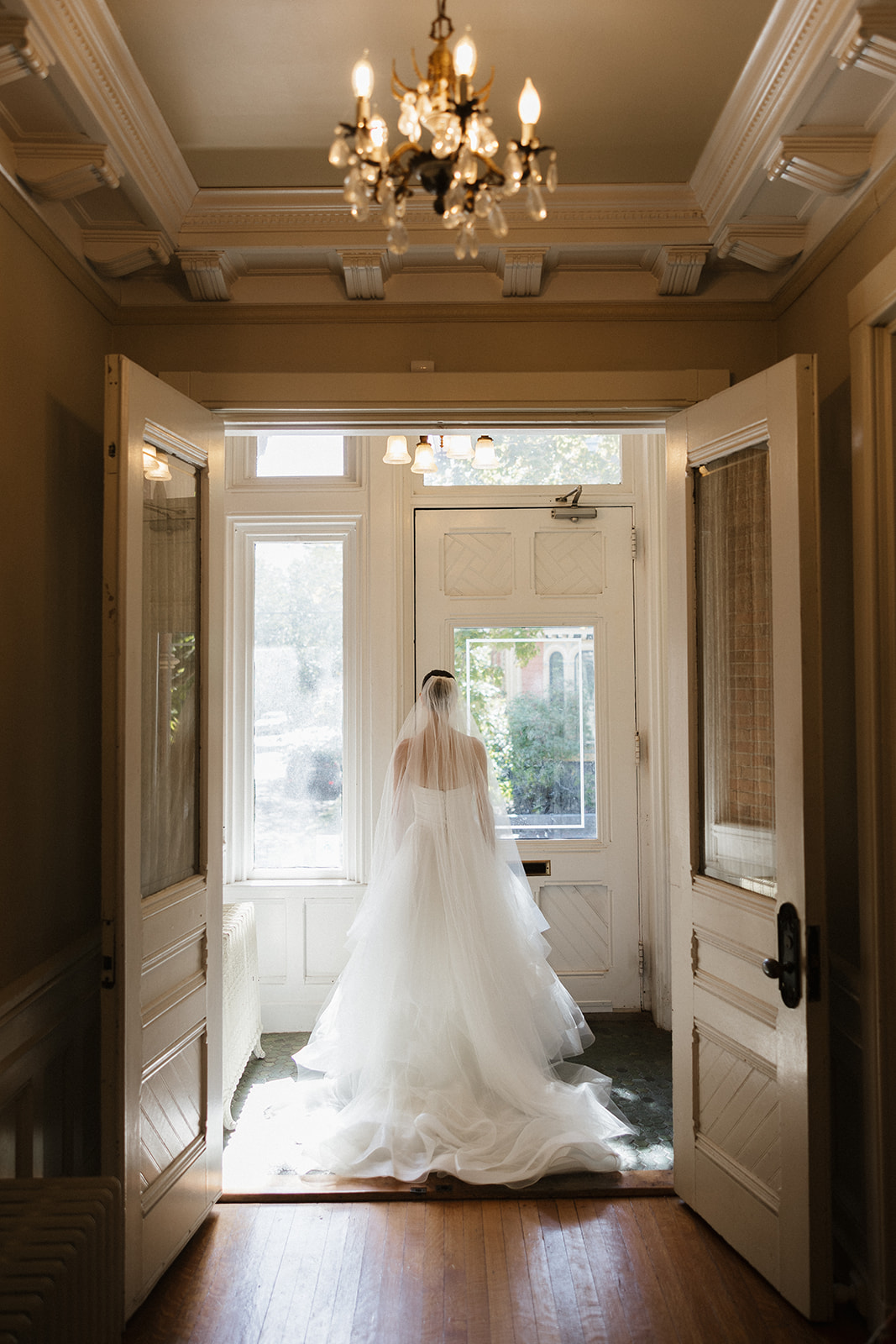 Bride poses for a photo as she prepares to exit the stunning Portland, Maine courthouse. 