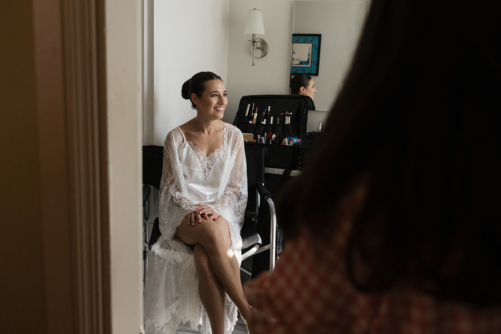 Bride candidly getting ready before her Portland, Maine courthouse wedding. 
