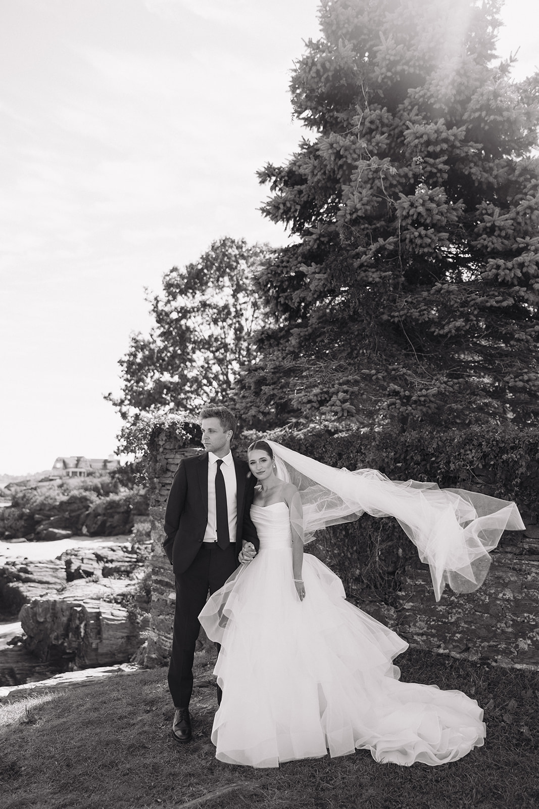 beautiful bride and groom pose for a photo after their Portland, Maine city hall wedding