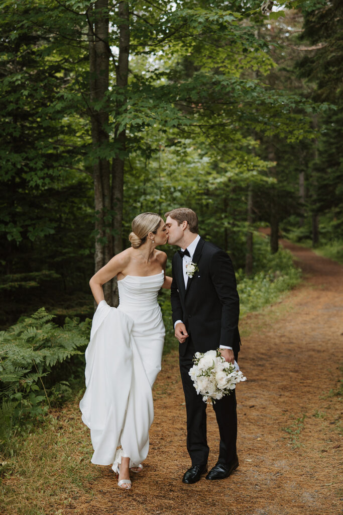 beautiful bride and groom share a kiss on their special day