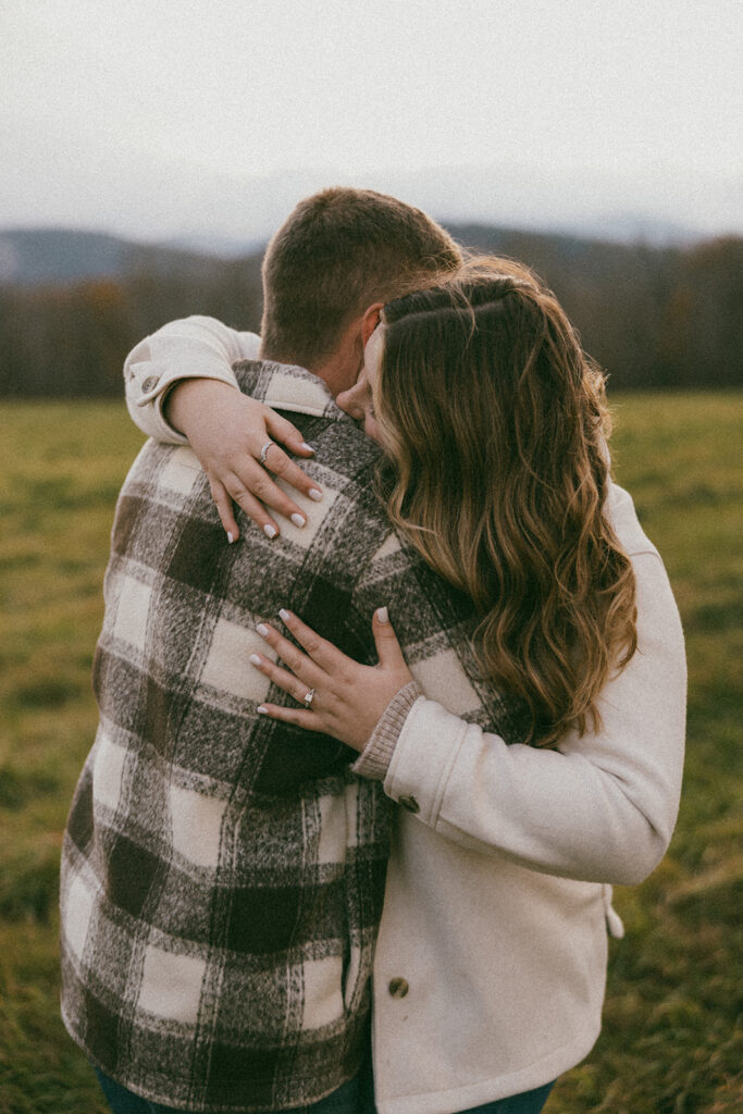 Candid couple during their engagement session in North Conway, New Hampshire
