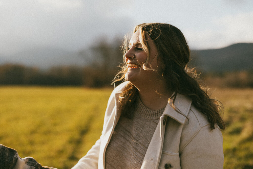 Candid couple laughing during their engagement session in North Conway, New Hampshire