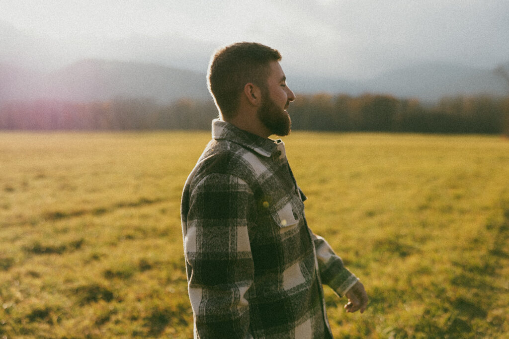 Candid couple laughing during their engagement session in North Conway, New Hampshire