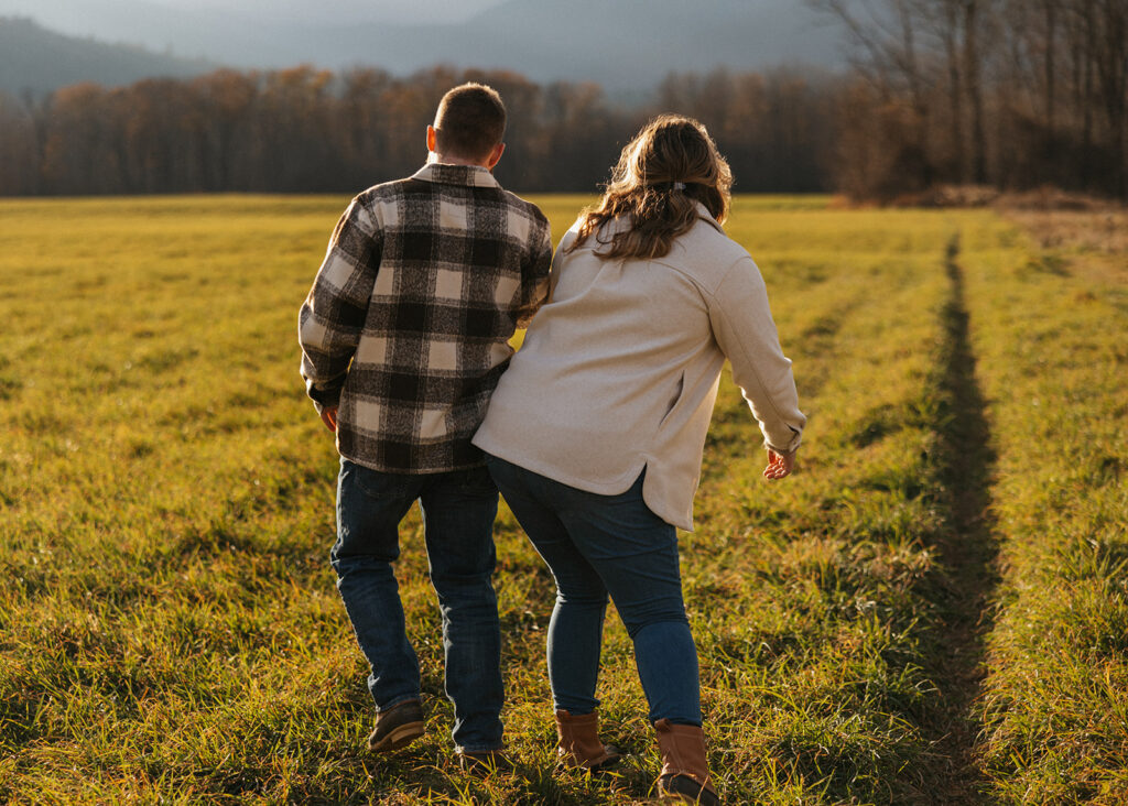 Candid couple laughing during their engagement session in North Conway, New Hampshire