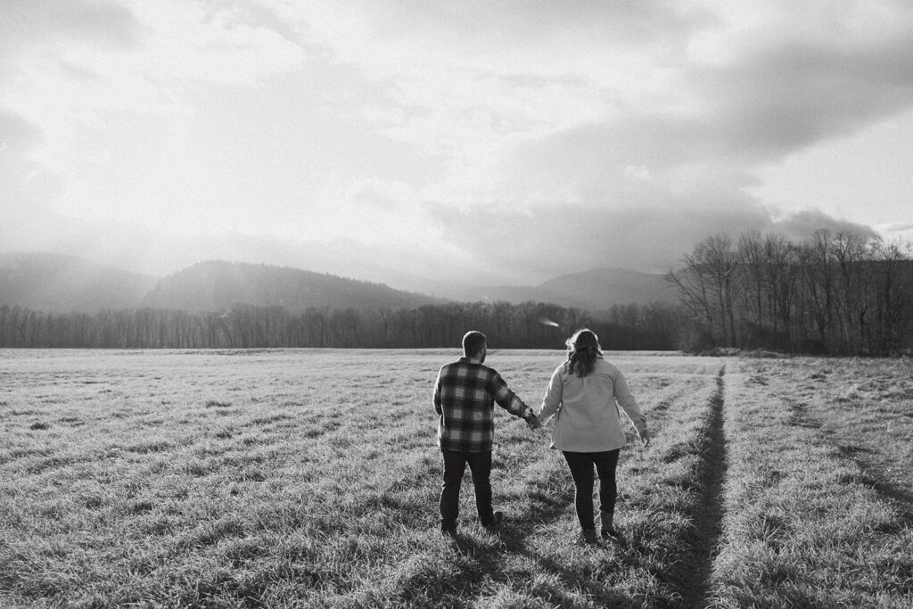 Natural and playful couple portraits in a field near Cathedral Ledge and Echo Lake