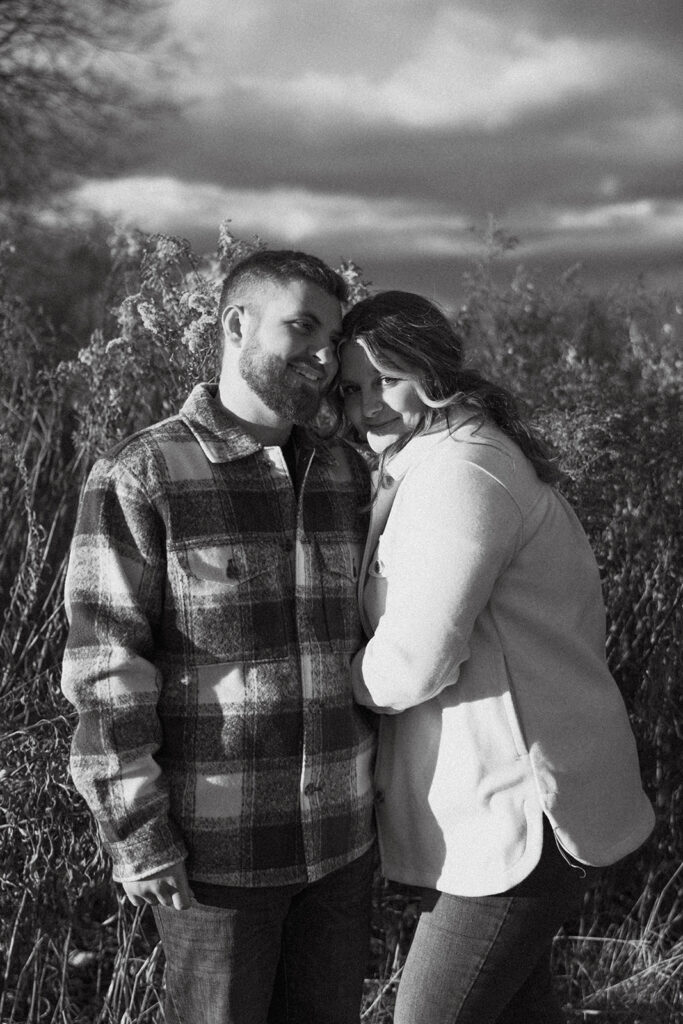 Natural and playful couple portraits in a field near Cathedral Ledge and Echo Lake
