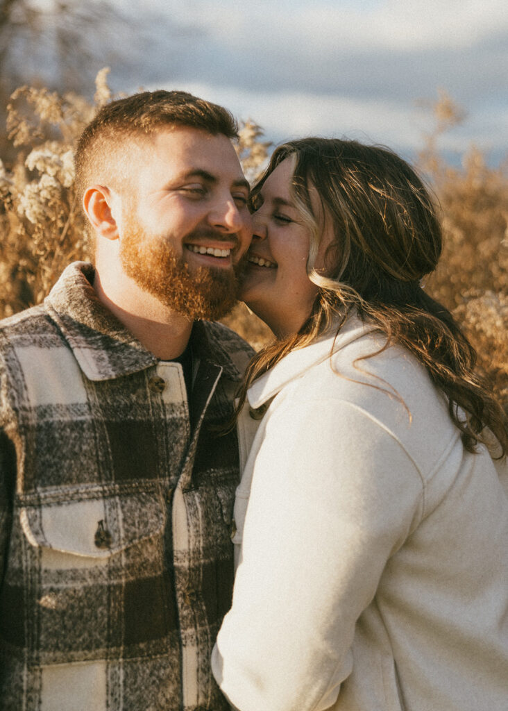 Natural and playful couple portraits in a field near Cathedral Ledge and Echo Lake