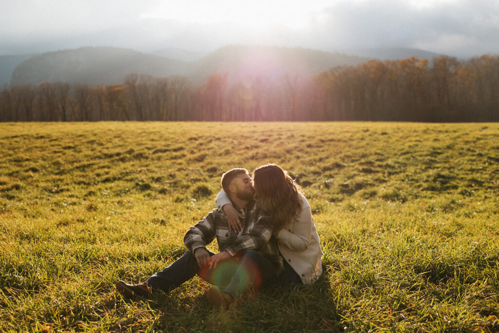 Natural and playful couple portraits in a field near Cathedral Ledge and Echo Lake