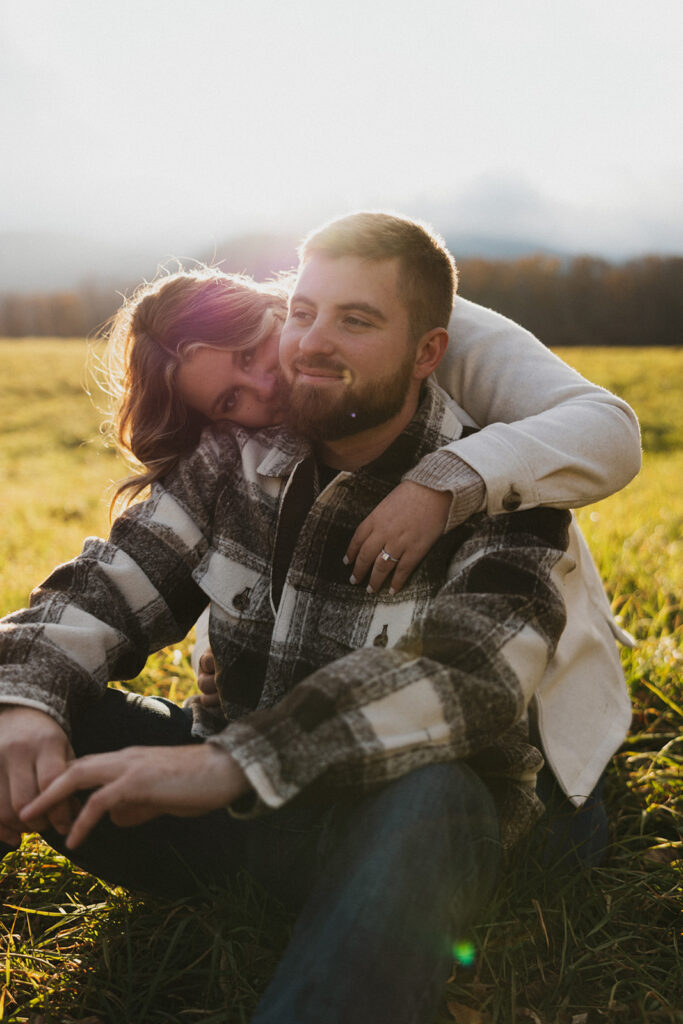 Natural and playful couple portraits in a field near Cathedral Ledge and Echo Lake