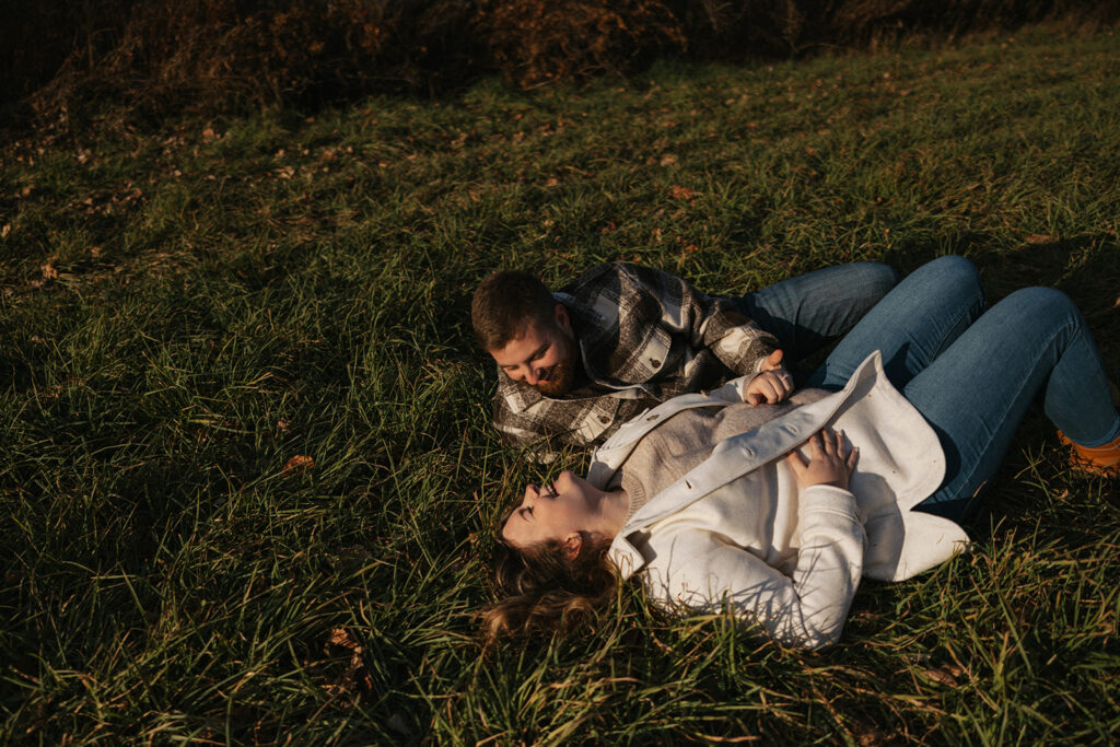 Candid couple laughing during their engagement session in North Conway, New Hampshire