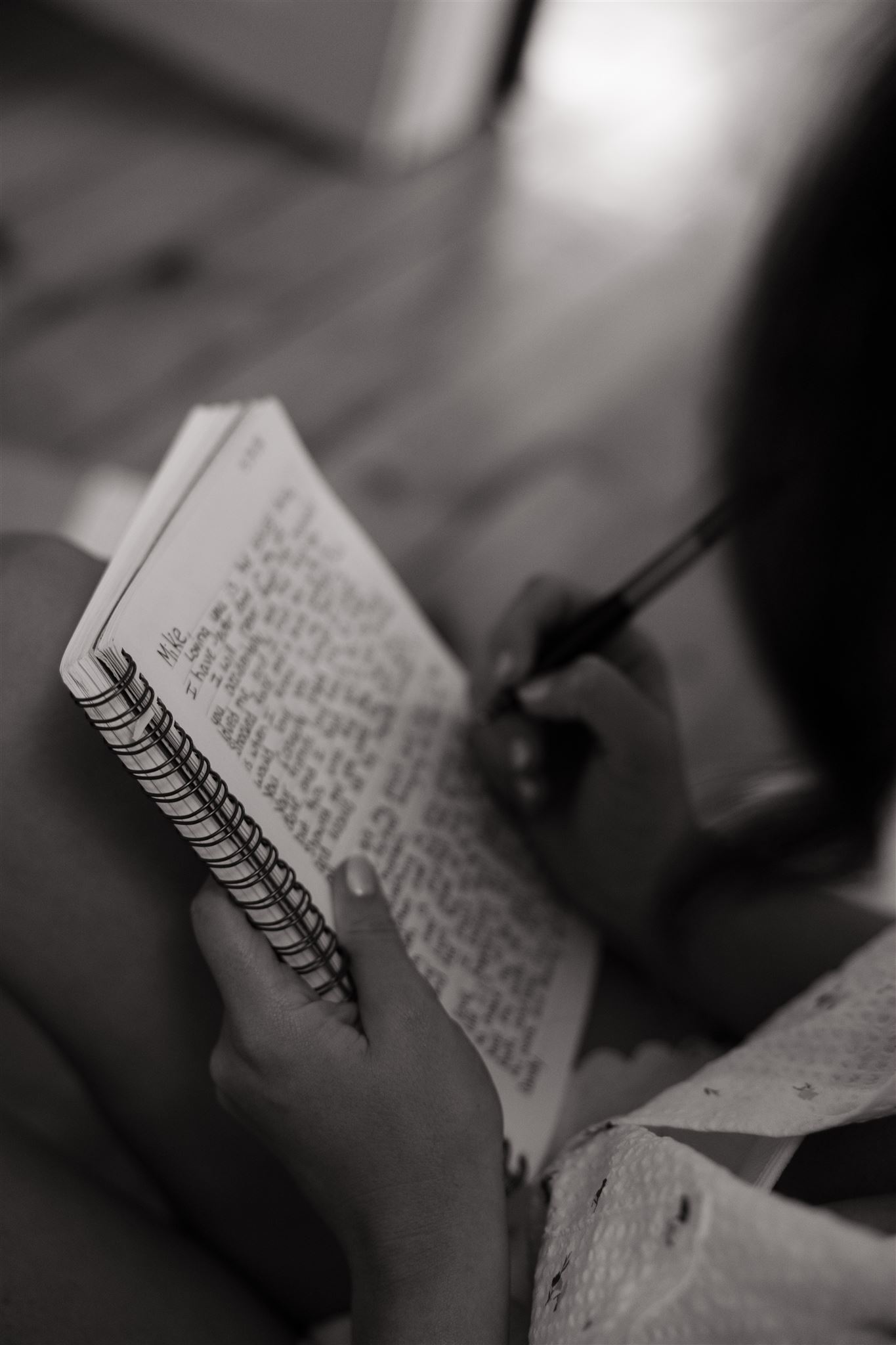 bride takes a moment to write her wedding vows before the ceremony